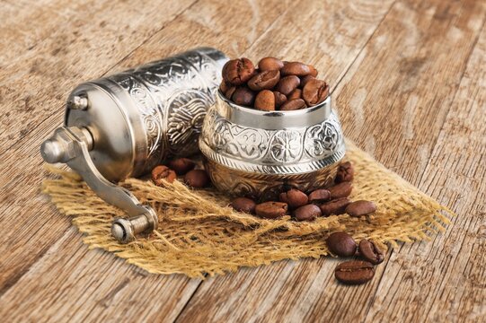 Old metal bowl with aroma coffee beens