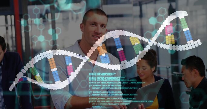 Standing man leading meeting in glass room, in business-casual, open laptop and DNA overlay visible