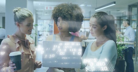 Leaning 3 women viewing laptop in office, holding coffee cup, sleeveless tops, with digital overlay