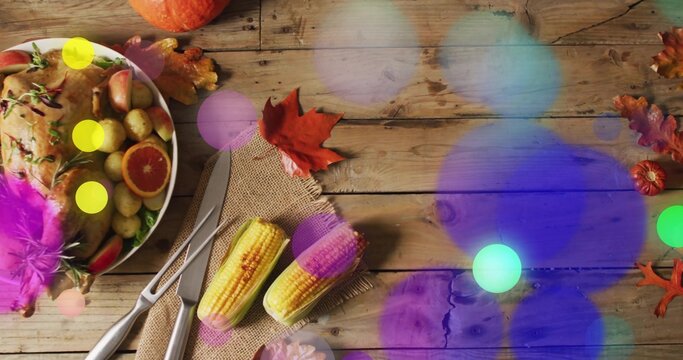 Displaying roasted bird on rustic table, with grilled corn, carving set, bokeh overlays, copy space