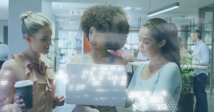 Leaning 3 women viewing laptop in office, holding coffee cup, sleeveless tops, with digital overlay