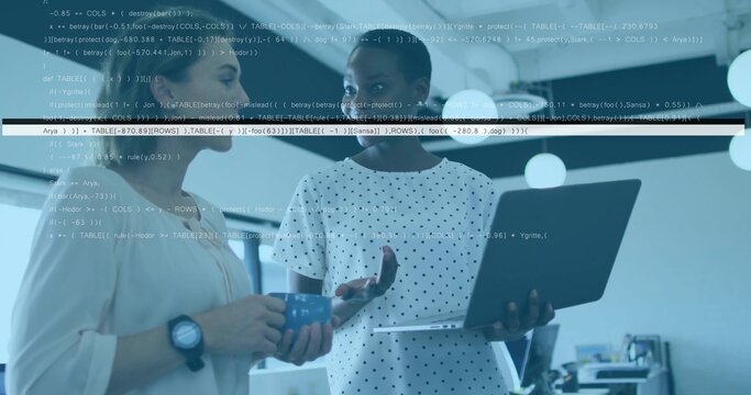 Discussing women in polka-dot blouse and watch holding laptop and blue mug in office, code overlay