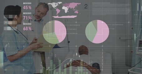 Standing clinicians and patient reviewing chart at bedside, in scrubs, coat, showing dashboard