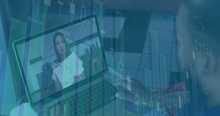 Typing hands at desk on laptop while presenter in dark blazer holding printed charts, overlays