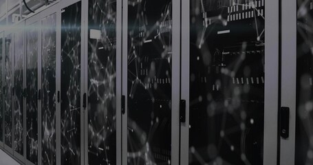 Glowing server cabinets showing glass doors, switches and cables in data center, showing overlay © vectorfusionart