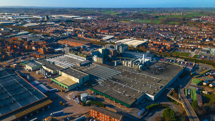 Massive industrial factory complex near urban residential area