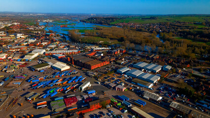 Industrial area and logistics yard near flooding river plain