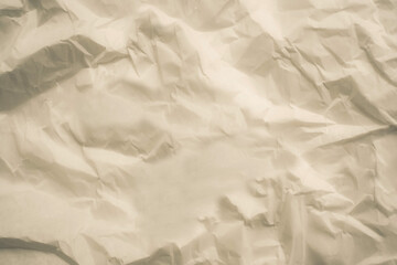 Obraz premium Crumpled paper texture. Background craft wrinkled paper. Neutral backdrop suitable for mockups, text overlays, and commercial use.