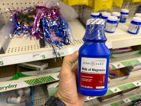 GeriCare Milk of Magnesia Bottle in Hand