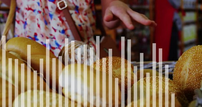 Basket of assorted bread in foreground, shopper hand entering, pressing sesame roll, lifting to buy