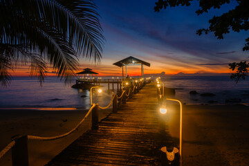Serene sunset over Koh Kood Island pier, creating a tranquil evening atmosphere