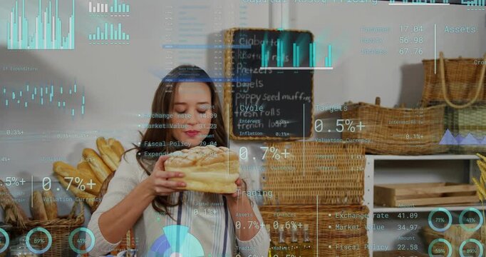 Female baker lifting loaf off counter turning smelling checking quality while HUD charts overlaying