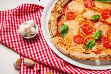 Plate with tasty pizza Margarita and bowl of mozzarella cheese on white background