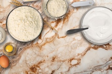 Collection of baking ingredients on the wooden desk