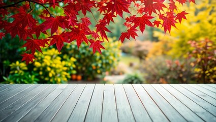 Vibrant red maple leaves frame a serene autumn garden scene with wooden deck