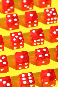 Red game dices on yellow background
