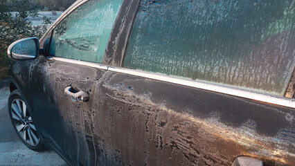 Car covered in frost and ice on a cold winter day