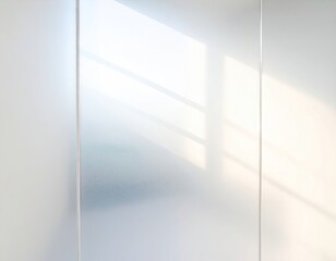 Bright window light casting shadows on white wall panels