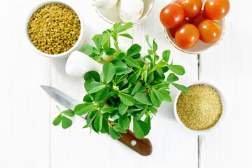 Fenugreek green in mortar on board top