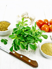 Fenugreek green in mortar on wooden board