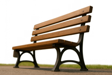 Empty wooden park bench with cast iron frame, isolated on transparent background, conveying waiting, solitude, and relaxation outdoors