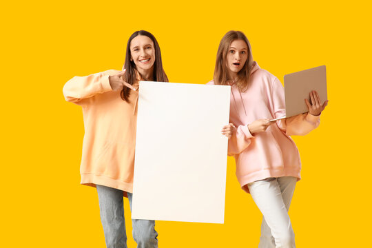 Young women with blank poster and laptop on yellow background - Powered by Adobe