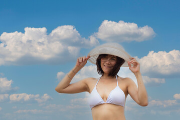 Summer vacations. Lifestyle woman relax and chill on beach background and fashion summer trips walking enjoy tropical beach. Lifestyle and Travel Concept.