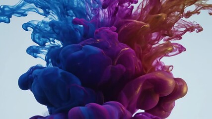 Colorful ink drops mixing and swirling underwater, creating mesmerizing patterns