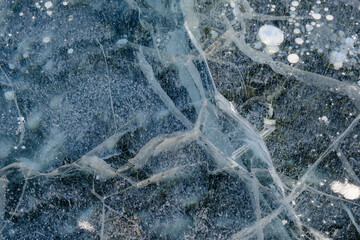 Beautiful ice of Lake Baikal with abstract cracks