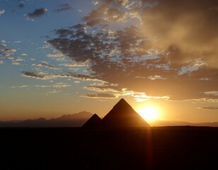 Sunset over ancient pyramids in the Egyptian desert