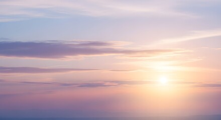 Ethereal sunrise painting the vast sky with gentle pastel hues, illuminating soft clouds and creating a tranquil, dreamlike atmosphere at dawn