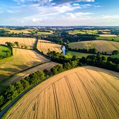 Aerial view of a rural landscape featuring fields and a road