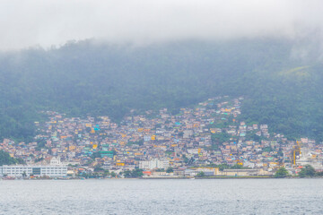 Obraz premium Mountains with favelas houses tropical nature Angra dos Reis Brazil.