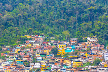 Mountains with favelas houses tropical nature Angra dos Reis Brazil.