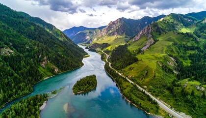Aerial view of river snaking between lush mountains, under cloudy sky