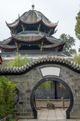 Admire the intricate designs of a Chengdu temple. The striking roof and delicate details highlight traditional Chinese architecture surrounded by peaceful gardens.