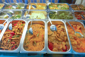 Assortment of Indonesian Buffet Dishes in a Canteen Food Display