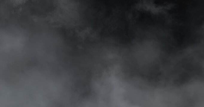 Artistic 4K slow-motion footage of swirling fog and soft drifting smoke clouds, evoking tranquil mystery, cinematic ambience, delicate vapor movement, and moody brume ideal for visual design.