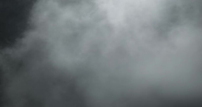 Professional 4K slow-motion VFX background of Halloween smoke and dense fog, an artistic spooky element for horror intros, eerie overlays, and cinematic visual storytelling projects.