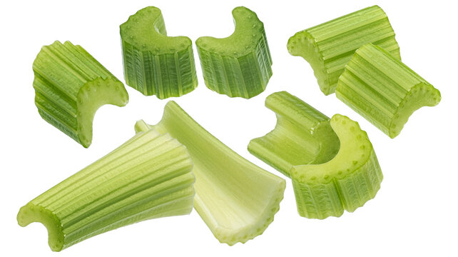 freshly cut raw celery stalks and chopped pieces, showcasing fibrous texture and bright green color isolated on transparent background.