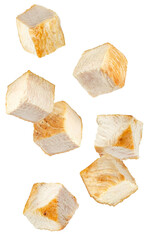clean photograph of falling, cubed pieces of cooked chicken breast with light golden searing isolated on a transparent background.