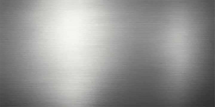A brushed stainless steel metal texture background or plate with a shiny metallic silver surface and industrial light reflection