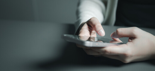 using, smartphone, social media, Hands holding and using a smartphone in a dim environment, representing digital communication, social media usage, mobile browsing, and modern online lifestyle.