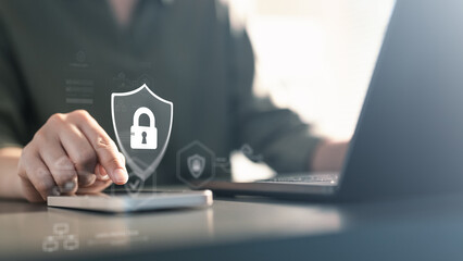 cybersecurity, security, A person using a mobile device with a digital lock shield icon,...
