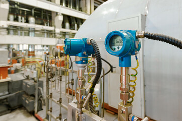 Equipment measuring temperature and pressure in a modern industrial facility during daylight hours
