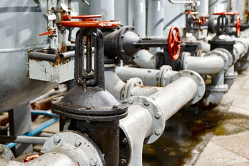 Industrial valve system in a modern facility showcasing intricate piping and controls during operational hours