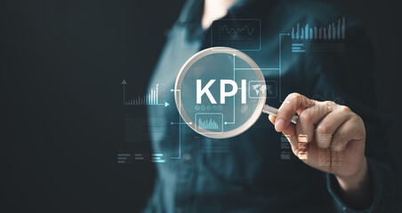 A person holding a magnifying glass over the word KPI with floating analytics charts, representing performance measurement, data analysis, strategy evaluation, and business monitoring.