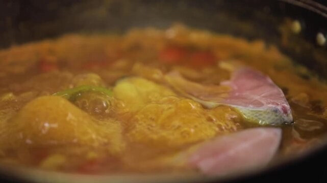 closeup shot of preparing hilsa fish curry.