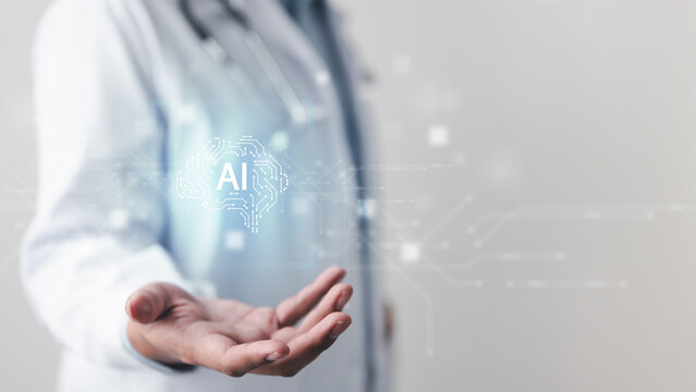 A doctor holding a floating AI graphic, symbolizing healthcare innovation, medical diagnosis technology, data-driven treatment, and the future of artificial intelligence in patient care. - Powered by Adobe
