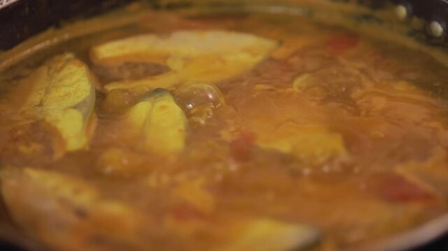 closeup shot of preparing hilsa fish curry.